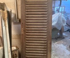 Louvered wood door for laundry or equipment room