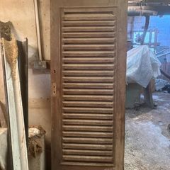 Louvered wood door for laundry or equipment room