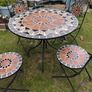 Ceramic table and four chairs. Image 5