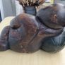 A large wooden statue of a sleeping Buddha Image 6