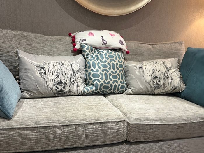 Grey fabric two-seater sofa
