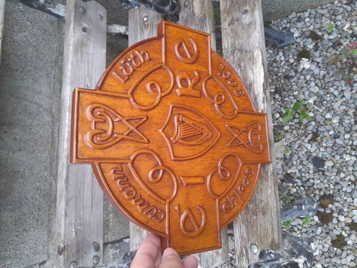 carved g.aa.a shield