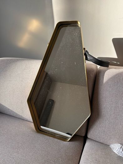 Brass and leather wall mirror