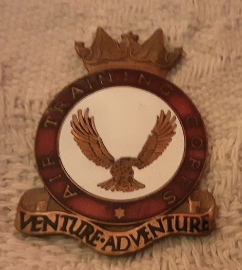 A T C badge