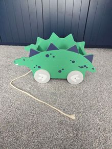 Dinosaur book/toy holder pull along
