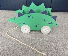Dinosaur book/toy holder pull along