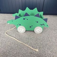 Dinosaur book/toy holder pull along