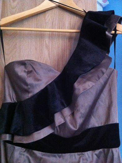 Beautiful one shoulder tan dress with black velvet ruffle on shoulder