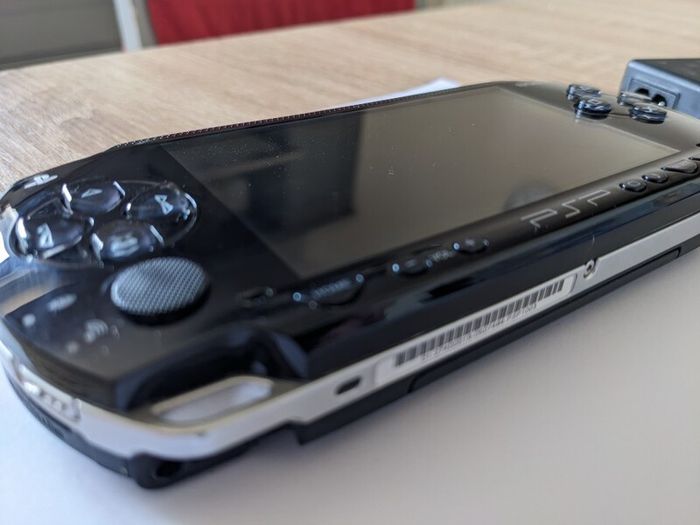 PSP original console with charger and battery