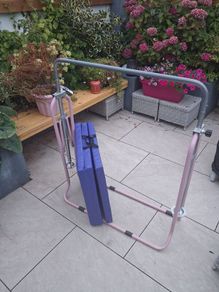 Kids gymnastics bar and folding mat