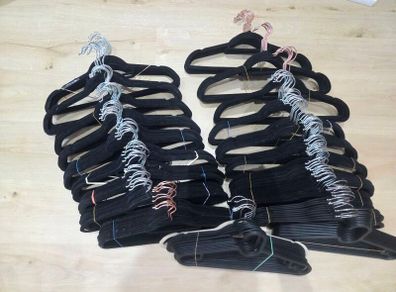 100 clothing hangers (mostly black velvet)