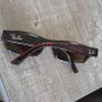 Vintage Ray-Ban sunglasses, Made in USA, with B&L engraved lenses and brown tortoiseshell frame. Lenses are in good condition, frame shows signs of wear. Please see all photos for details. Image 10