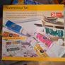 Easel And Selection Of Paints And Book Image 4