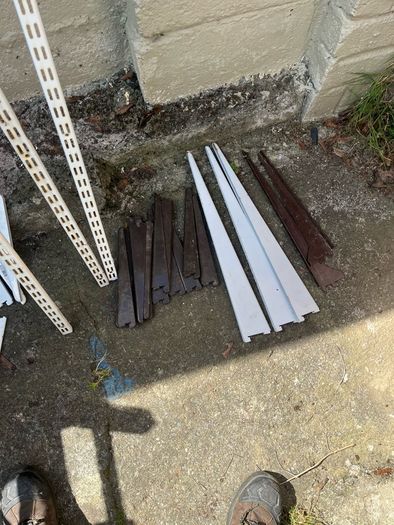Adjustable shelving rails and brackets