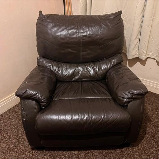 black leather sofa and arm chairs