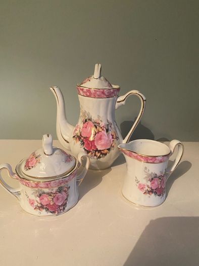 Vintage Porcelain small teapot sugar bowl and creamer set .       porcelain