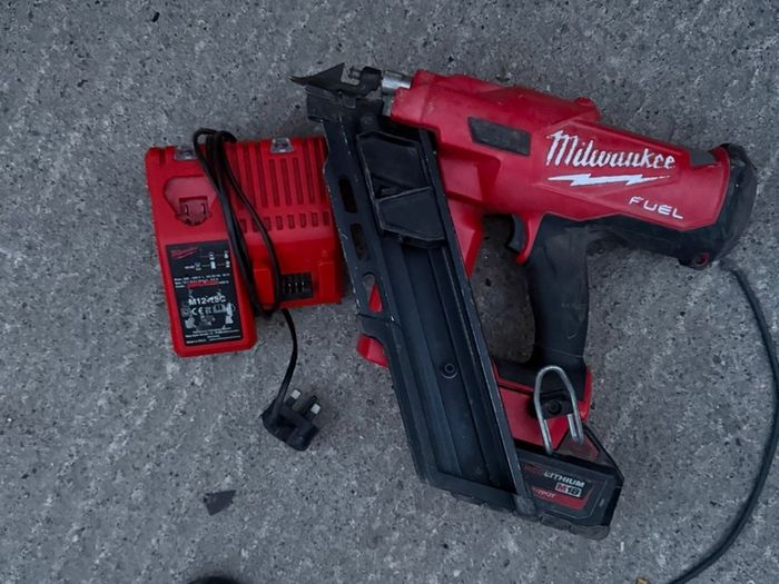 M18 FUEL First Fix Framing Nailer (M18 FFN), a 5.0Ah battery, and the dual M12-18C charger,