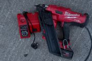 M18 FUEL First Fix Framing Nailer (M18 FFN), a 5.0Ah battery, and the dual M12-18C charger,