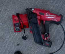 M18 FUEL First Fix Framing Nailer (M18 FFN), a 5.0Ah battery, and the dual M12-18C charger,