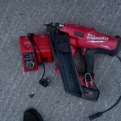 M18 FUEL First Fix Framing Nailer (M18 FFN), a 5.0Ah battery, and the dual M12-18C charger,
