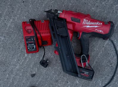 M18 FUEL First Fix Framing Nailer (M18 FFN), a 5.0Ah battery, and the dual M12-18C charger,