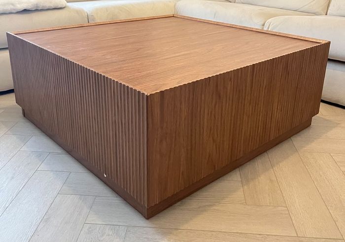 Square wooden coffee table with fluted detailing