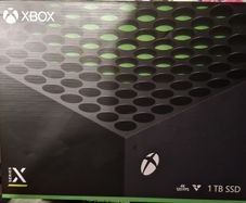 Xbox Series X with box and games