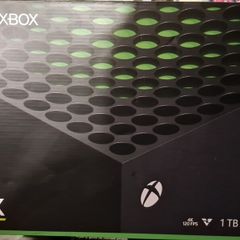 Xbox Series X with box and games