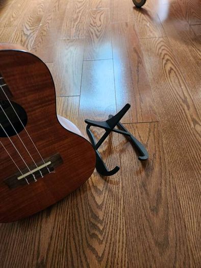 Ultra Lightweight Folding Travel Guitar Stand Portable Universal Instrument Holder for Acoustic Electric Classical Bass Folk Flamenco Travel Guitar Ukulele Mandolin Banjo Compact Collapsible Floor Display Rack with Protective Foam Padding Anti Slip Rubber