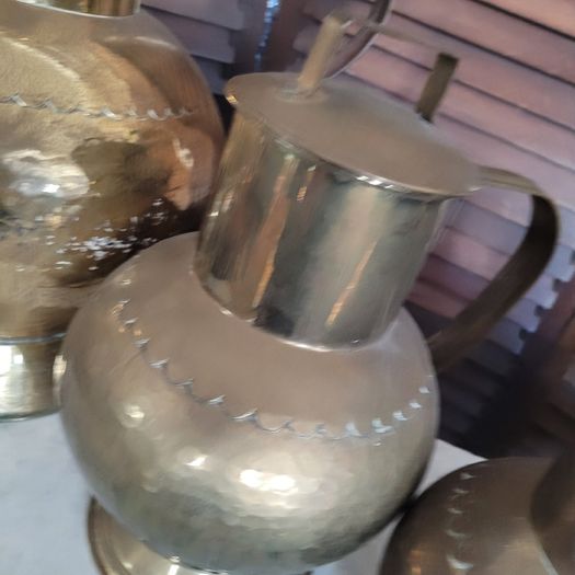 Antique brass & copper graduated collection of lidded dairy pitchers
