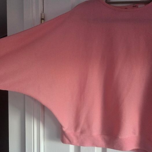 Pink long sleeve top cut back, size 10