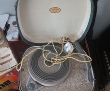 Vintage portable turntable and old records