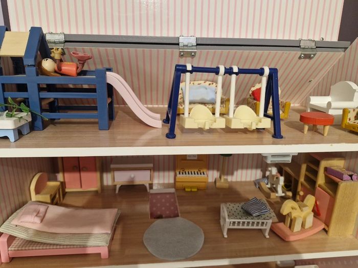 Wooden dolls house with furniture