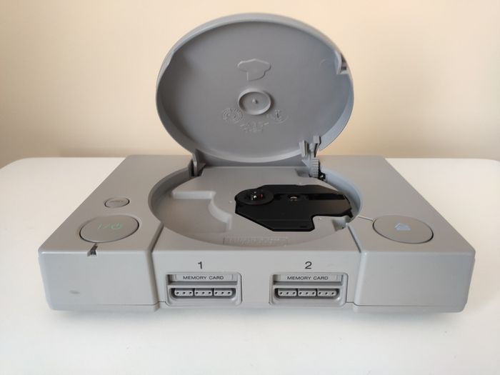 Playstation 1 console SCPH-7502 with games and cords