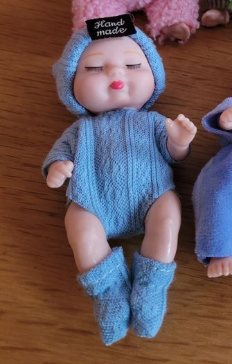 Mini baby dolls in sweet outfits