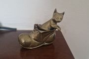 brass cat in boot