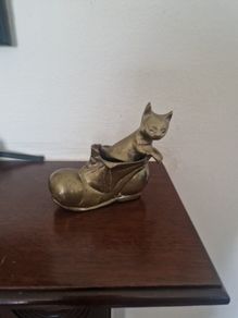 brass cat in boot