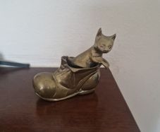 brass cat in boot