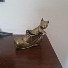brass cat in boot