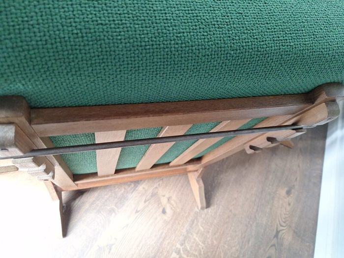 Pair of green arm chairs.