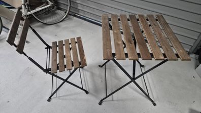 2 IKEA folding tables and 4 matching folding chairs.