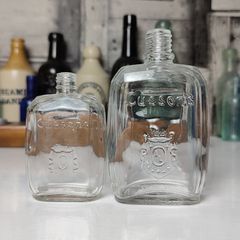 377 - Set of 2 Vintage Collectible Decorative Clear Glass Cussons Bottles