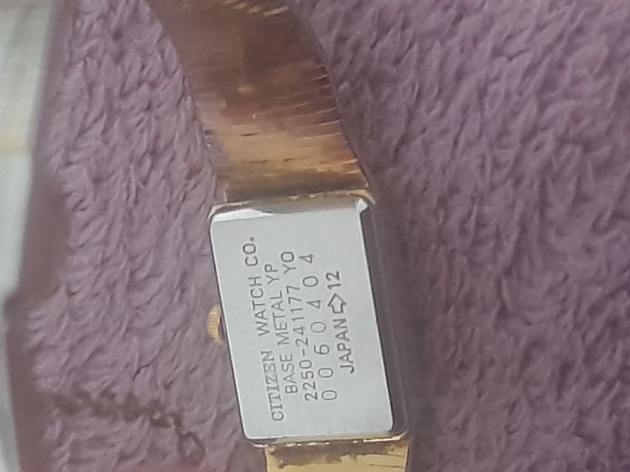 Gold plated ladies vintage citronella quartz wrist watch complete with safety chain