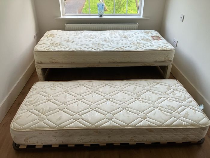 Single bed with pullout bed underneath