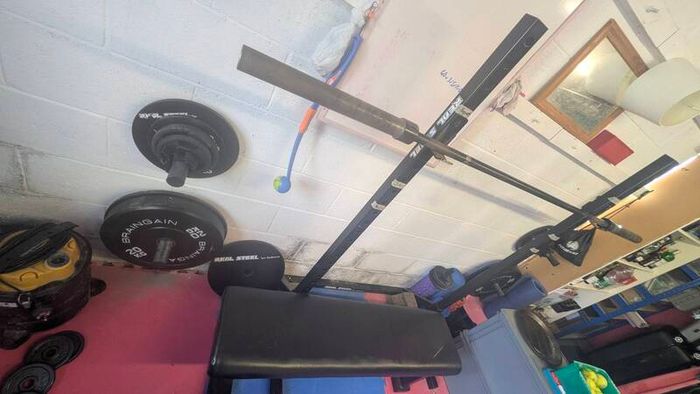 gym equipment - barbell - squat rack - dumbbells