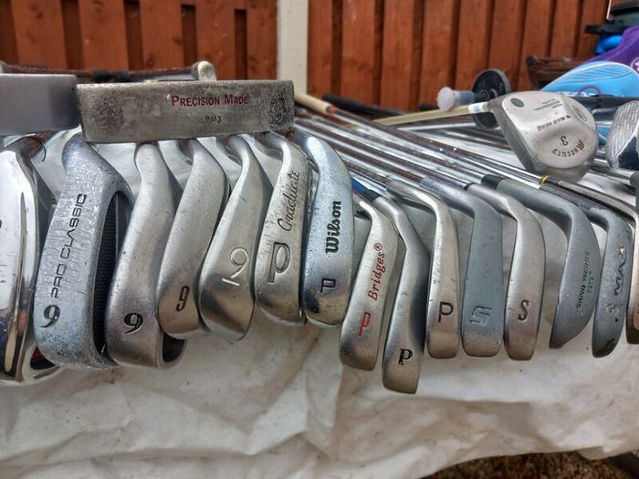 A selection of golf clubs and bags. NOT SELLING SEPARATE