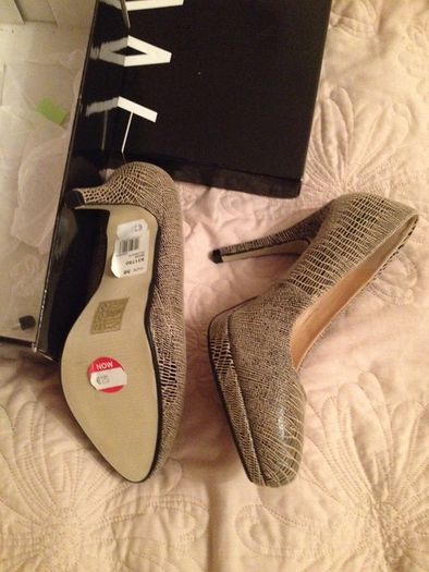 Size 5 brand new tan print love them but can't wear heels anymore