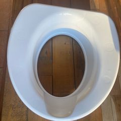Raised toilet seat