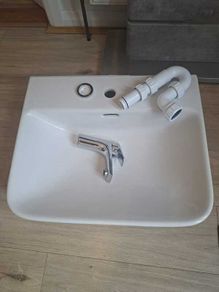 Basin with tap