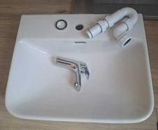 Basin with tap